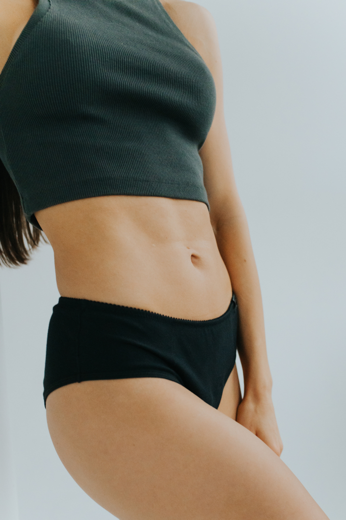 Model showcasing the new collection of period panties made from soft, breathable cotton. Stylish and eco-friendly design for comfortable menstrual protection.