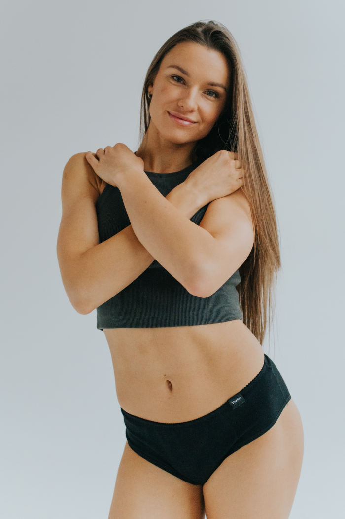 Model showcasing the new collection of period panties made from soft, breathable cotton. Stylish and eco-friendly design for comfortable menstrual protection.
