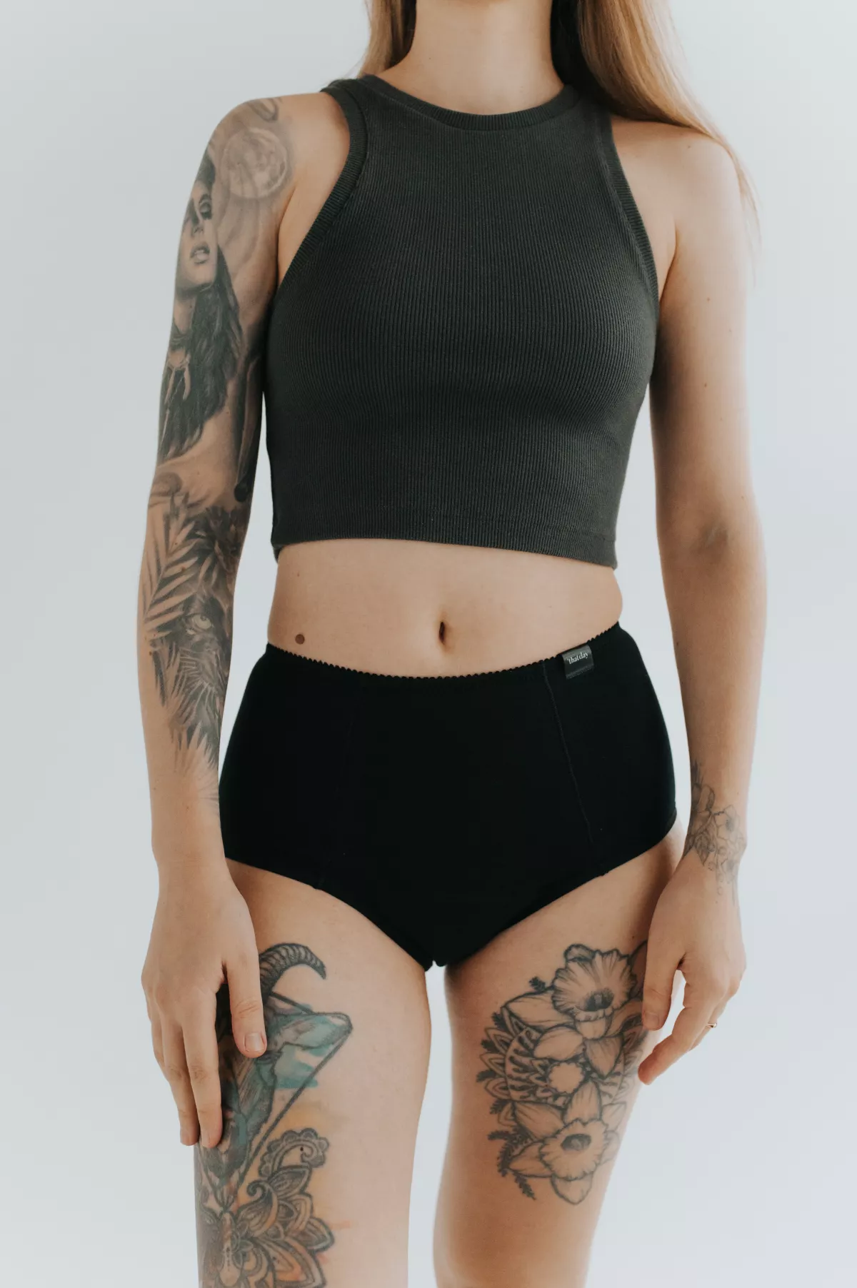 Model showcasing the new collection of period panties made from soft, breathable cotton. Stylish and eco-friendly design for comfortable menstrual protection.