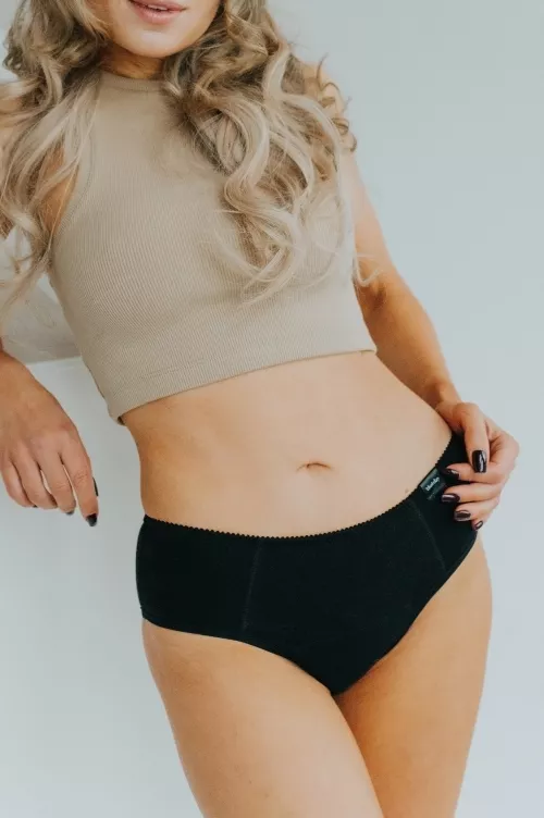 Model showcasing the new collection of period panties made from soft, breathable cotton. Stylish and eco-friendly design for comfortable menstrual protection.