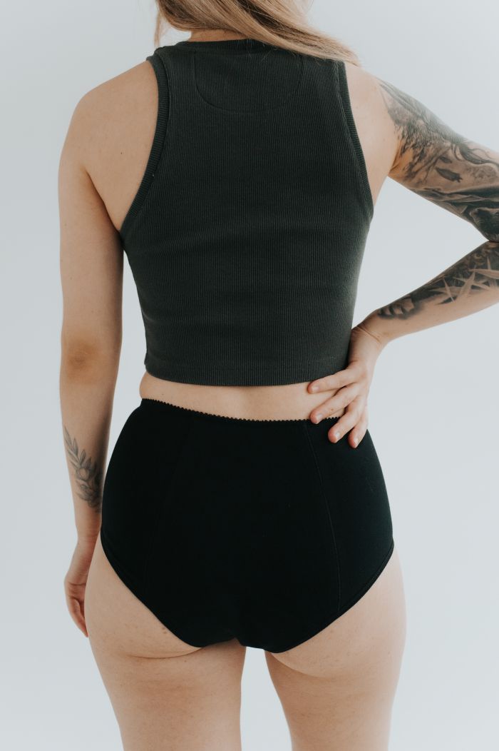 Model showcasing the new collection of period panties made from soft, breathable cotton. Stylish and eco-friendly design for comfortable menstrual protection.