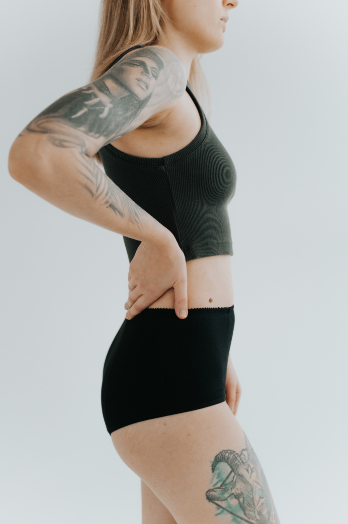 Model showcasing the new collection of period panties made from soft, breathable cotton. Stylish and eco-friendly design for comfortable menstrual protection.