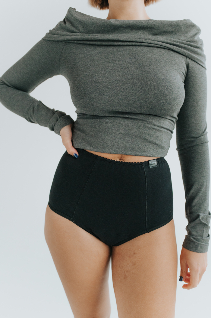 Model showcasing the new collection of period panties made from soft, breathable cotton. Stylish and eco-friendly design for comfortable menstrual protection.