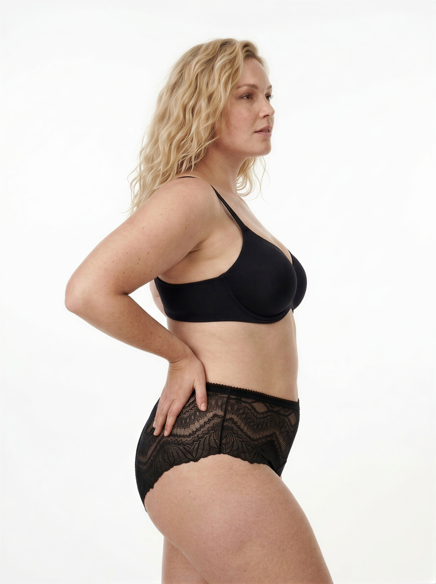 Model wearing black limited edition ALMA lace mid-rise period-proof lingerie